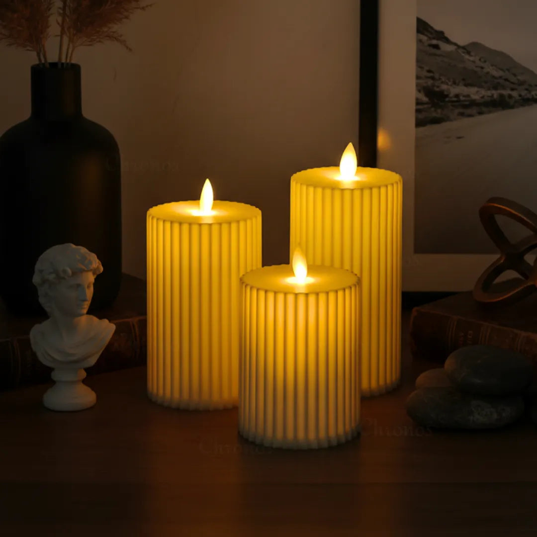 Pleated ivory LED moving wick pillar candle with warm glow