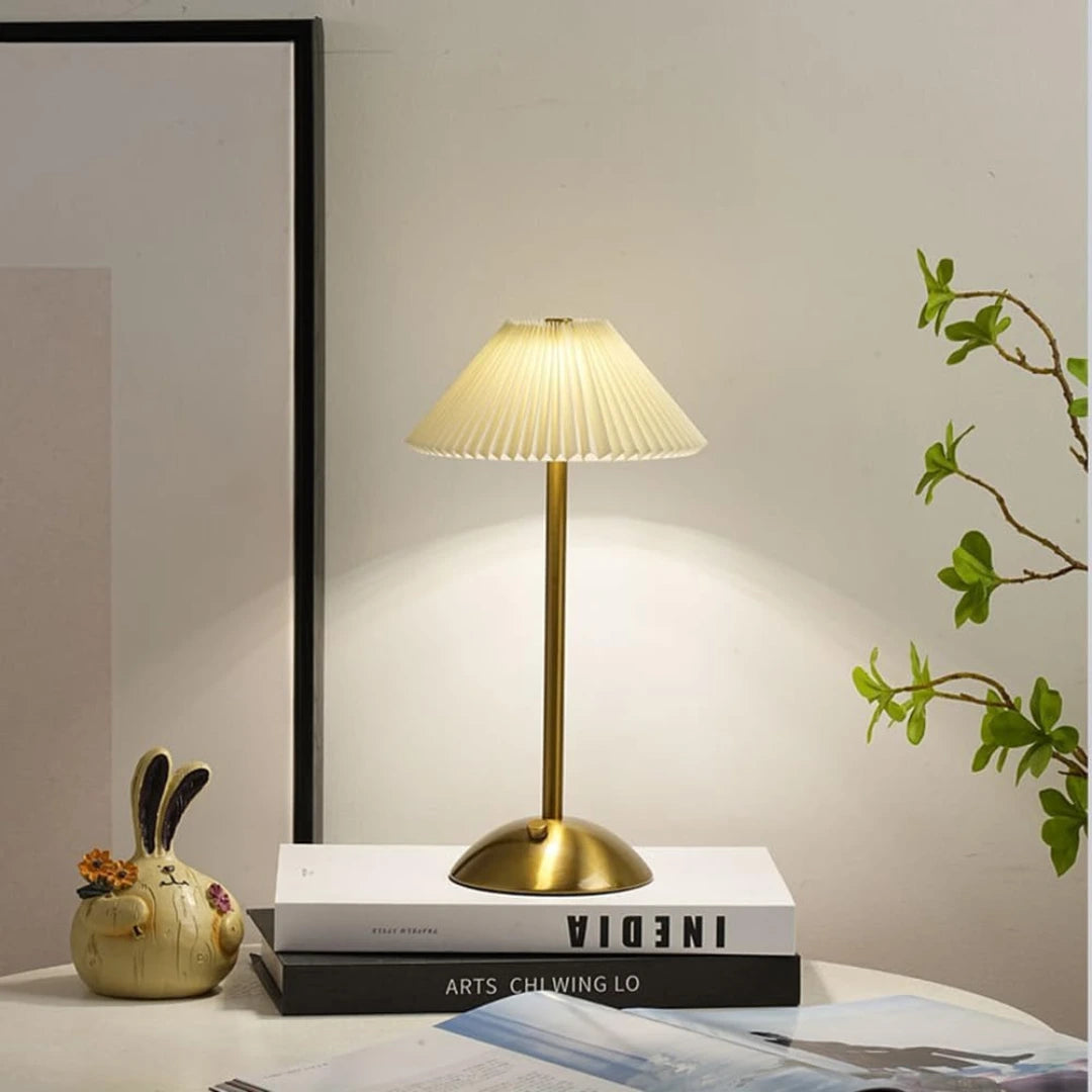 Rechargeable LED table lamp with touch control from Chronos Lights, offering 3 color modes and a sleek brass finish.