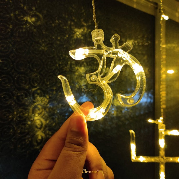 Plug-powered and extendable OM Swastik LED curtain lights for large Ganesh Chaturthi decorations
