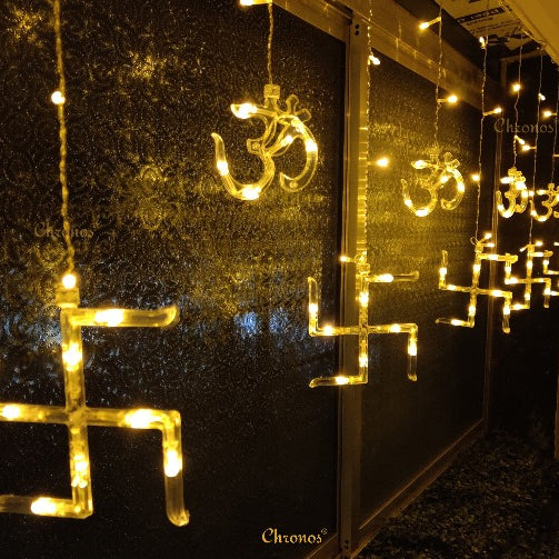 Spiritual OM Swastik LED curtain lights in yellow glow for puja décor, festivals, and divine celebrations