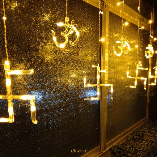 OM Swastik hanging curtain lights with warm yellow LED glow for Ganpati mandap and puja backdrop