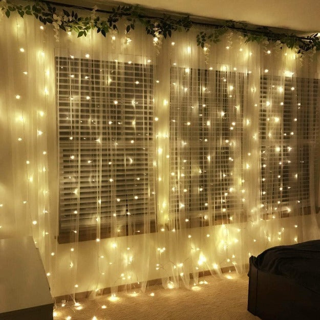 Elegant warm white curtain LED string lights for festive and wedding décor