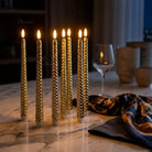 Installing AAA batteries inside LED flameless taper candle