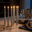 Battery operated LED taper candles decorating an elegant dining table