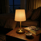 Linea fabric shade table lamp providing soft diffused ambient lighting for bedrooms and living spaces