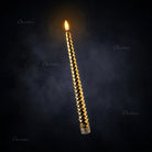 LED flameless taper candle fitting inside a standard taper candle holder