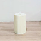 Battery operated pleated LED pillar candle
