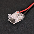 Close-up view of Chronos Lights LED strip connector with copper contacts.
