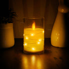 Realistic LED pillar candle with imitation glass, ideal for weddings and special occasions.