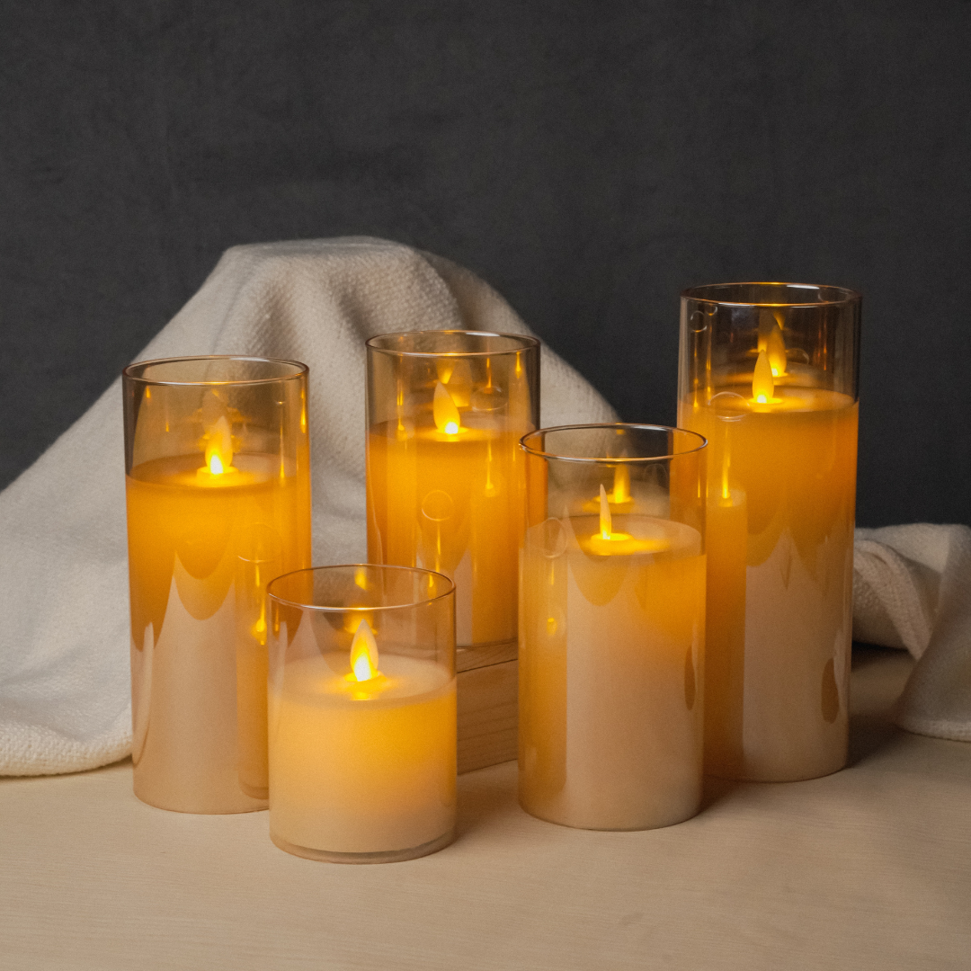 Flickering flame effect LED golden glass pillar candle for cozy ambiance