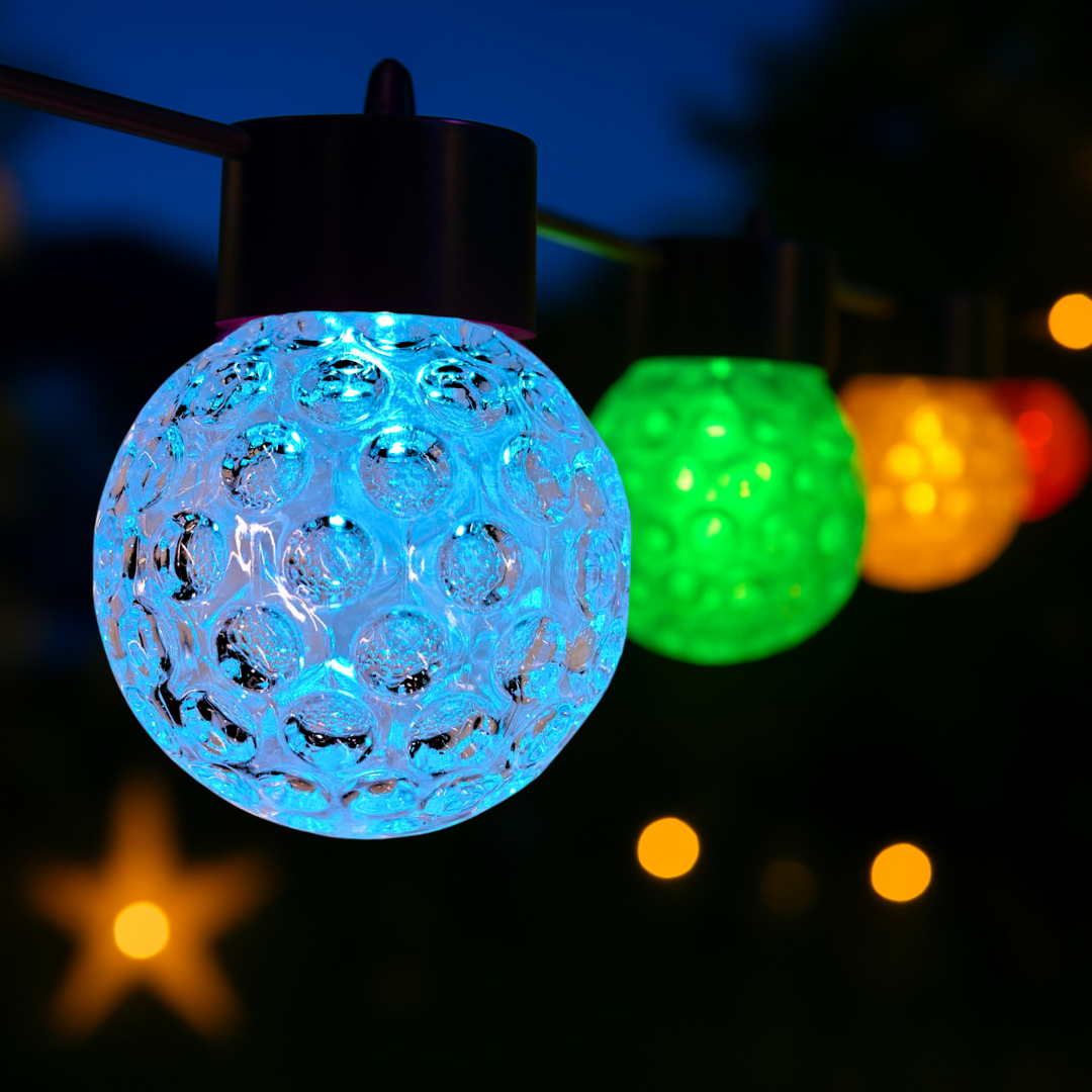 Close-up of waterproof LED bulbs glowing in light drizzle