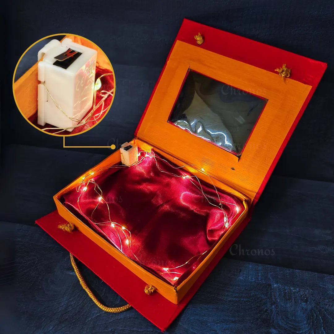 Decorative warm white fairy lights installed in a gift box using a hook.
