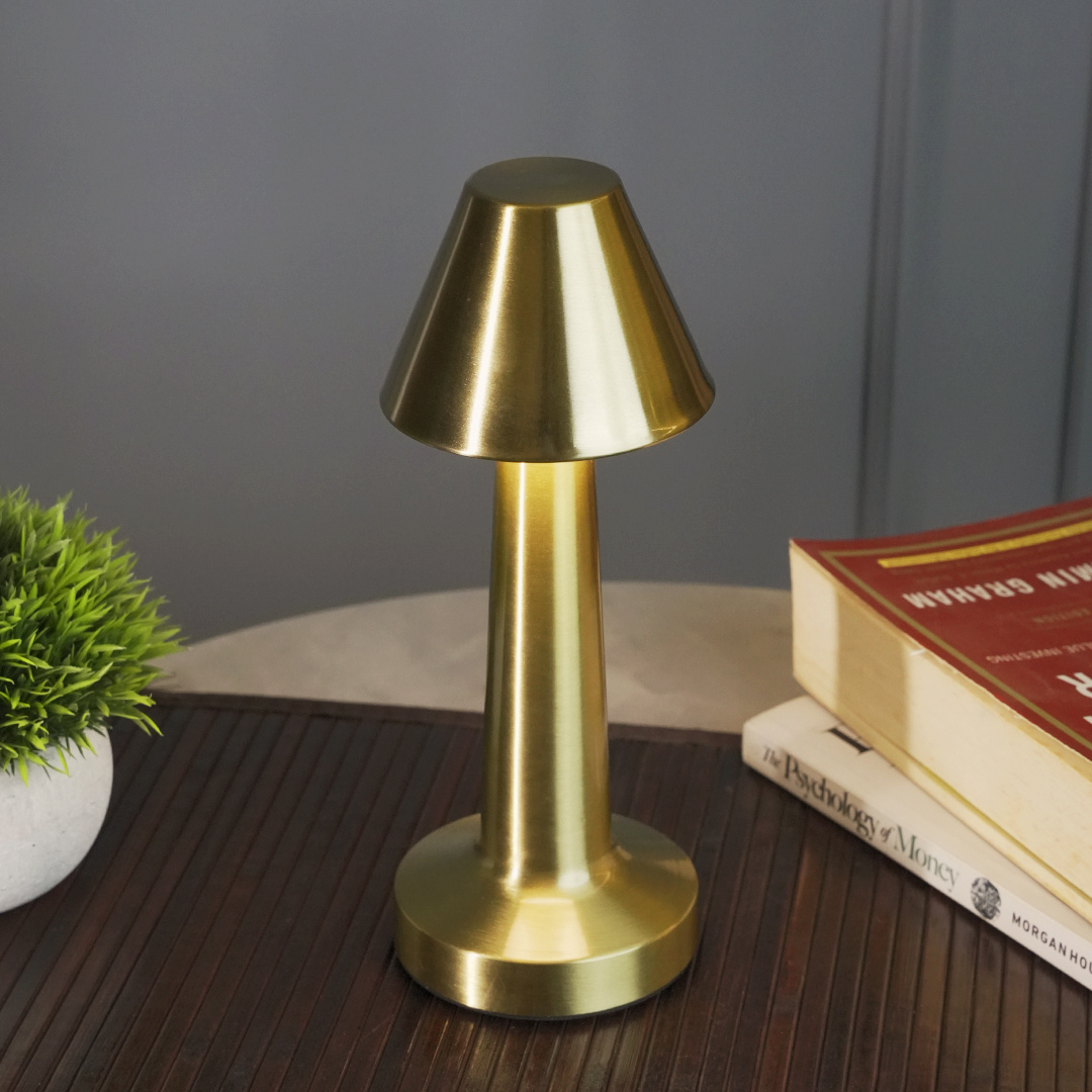 Gold finish pyramid table lamp with warm, natural, and cool white LED lighting
