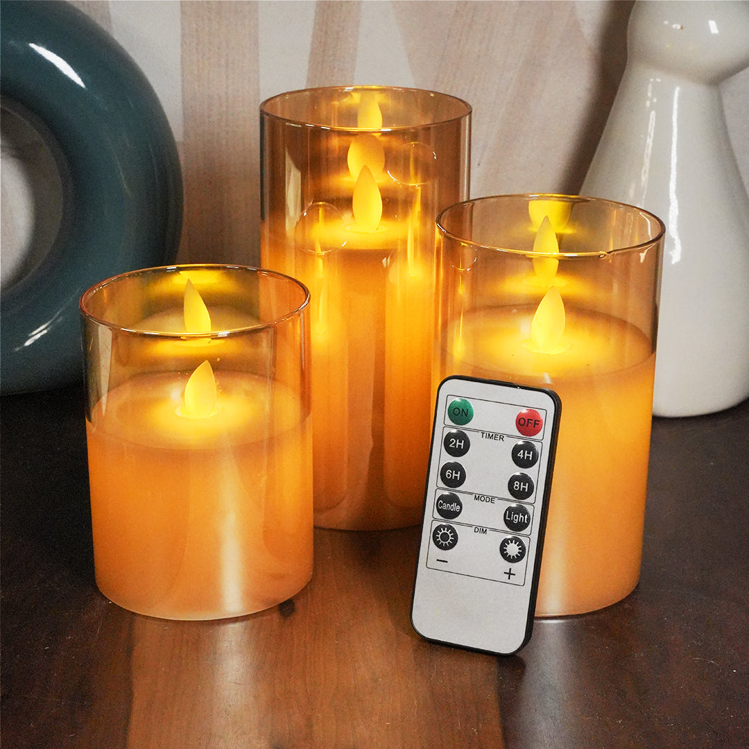 Golden glass LED pillar candle with moving flame for elegant home and festive décor