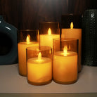 Rechargeable LED moving flame candle with an elegant golden glass finish.