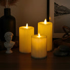 Pleated ivory LED moving wick pillar candle with warm glow