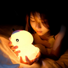 Portable soft touch night light with USB charging, providing a calming ambiance for kids.