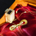 Close-up of warm white LED lights glowing during a gift box unboxing moment.