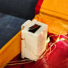Warm white waterproof LED fairy lights installed in gift box with a hook.