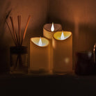 Battery operated LED jumping wick candle powered by AAA batteries