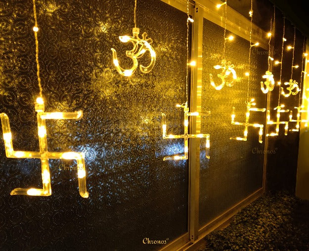 OM Swastik hanging curtain lights with warm yellow LED glow for Ganpati mandap and puja backdrop