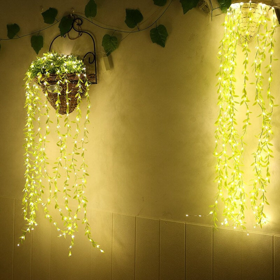 Warm white fairy lights intertwined with leaf vine for elegant festive lighting – Chronos Lights